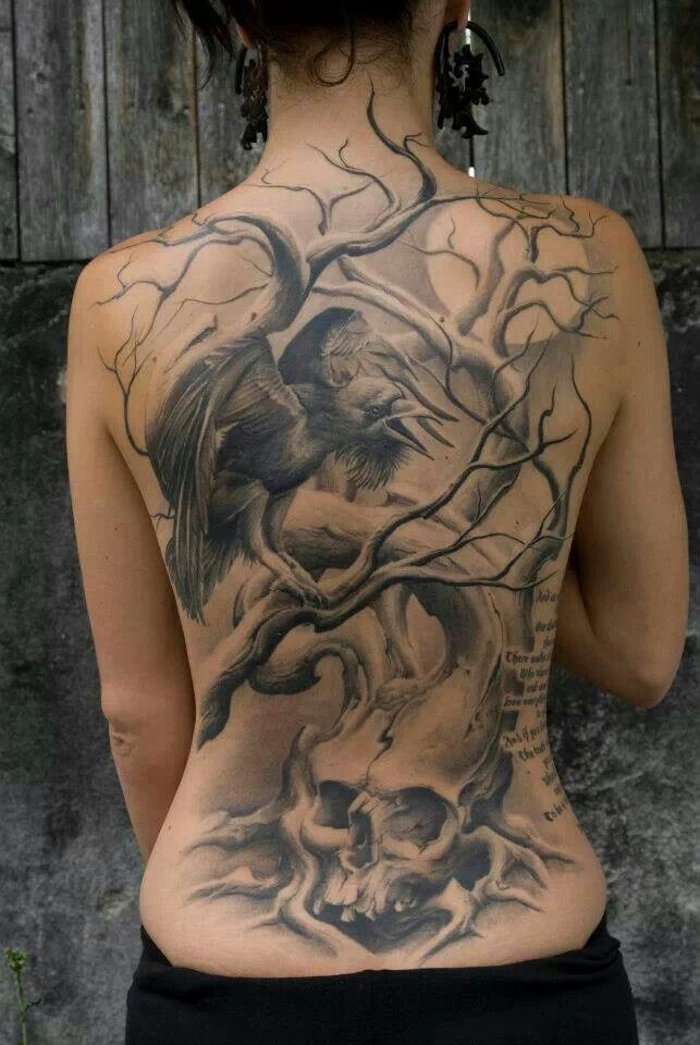 Black raven on tree with skull tattoo on back